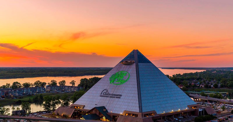 Pyramid exterior with sunset, sign lit.jpg