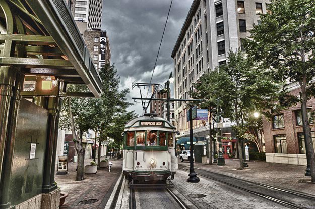 A Riverfront Loop trolley rumbles down the Main Street Mall.