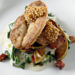 Among innovative specialties at Andrew Michael's is the sweetbread dish, with collards, pancetta, apple, and pickled mustard seed.