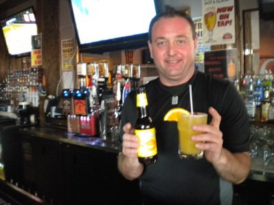 Mike Turner, manager of Jack Magoo's on Broad Ave., with Wheach Peach Wheat, his new favorite beer for summer.