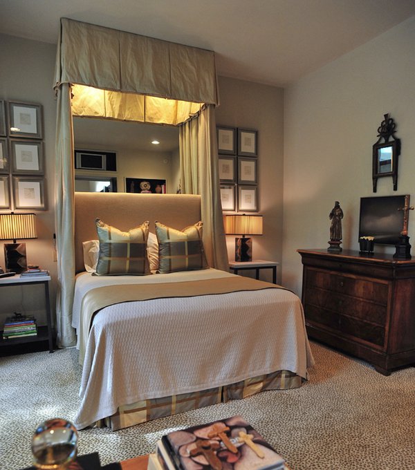 A set of 12 lithographs frames the bed in the newly updated master bedroom.