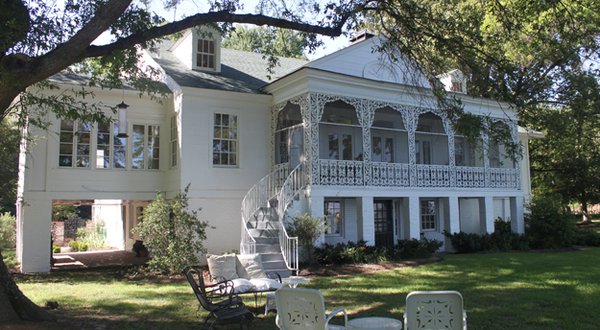 The rear of the house, facing the lake, is a shady retreat. The Snowdens were world travelers, and on a trip through Louisiana, Grace noticed a Greek Revival-style home in the Bayou Country. When the Snowden House was expanded in 1949, she asked the ...