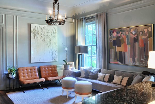 The grey paint palette, Barcelona chair, and Edelstein painting in this sitting room demonstrate a more modern esthetic.