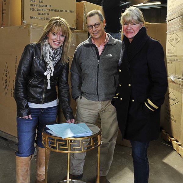 Designer Laurie Jones with Bob Berry and Lucy Woodson in World's Away warehouse.
