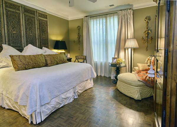 The spacious downstairs master bedroom is both tailored and inviting.