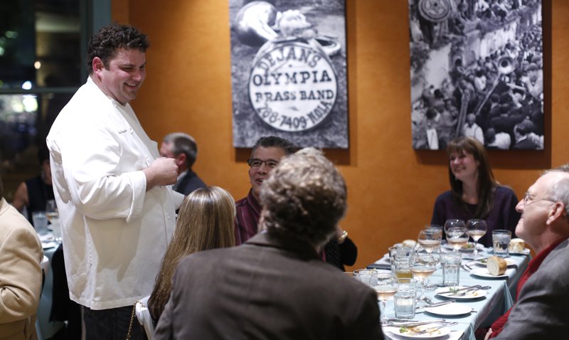 Chef Kelly English, above, greets guests at an opening party for The Second Line, his new restaurant and bar located next to Restaurant Iris.