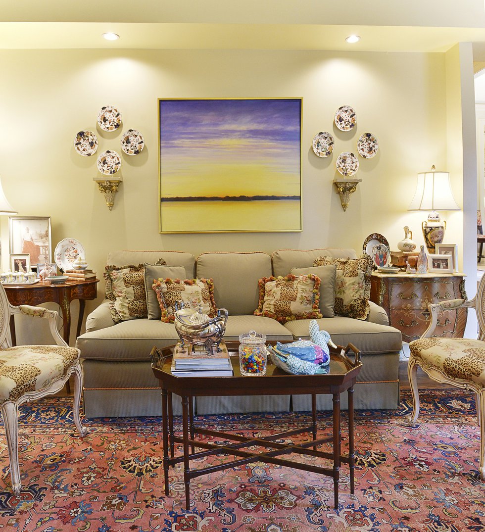 Another view of the living room with its mix of antique porcelain and a modern Mississippi River scene by Memphis artist Martha Scott. 
