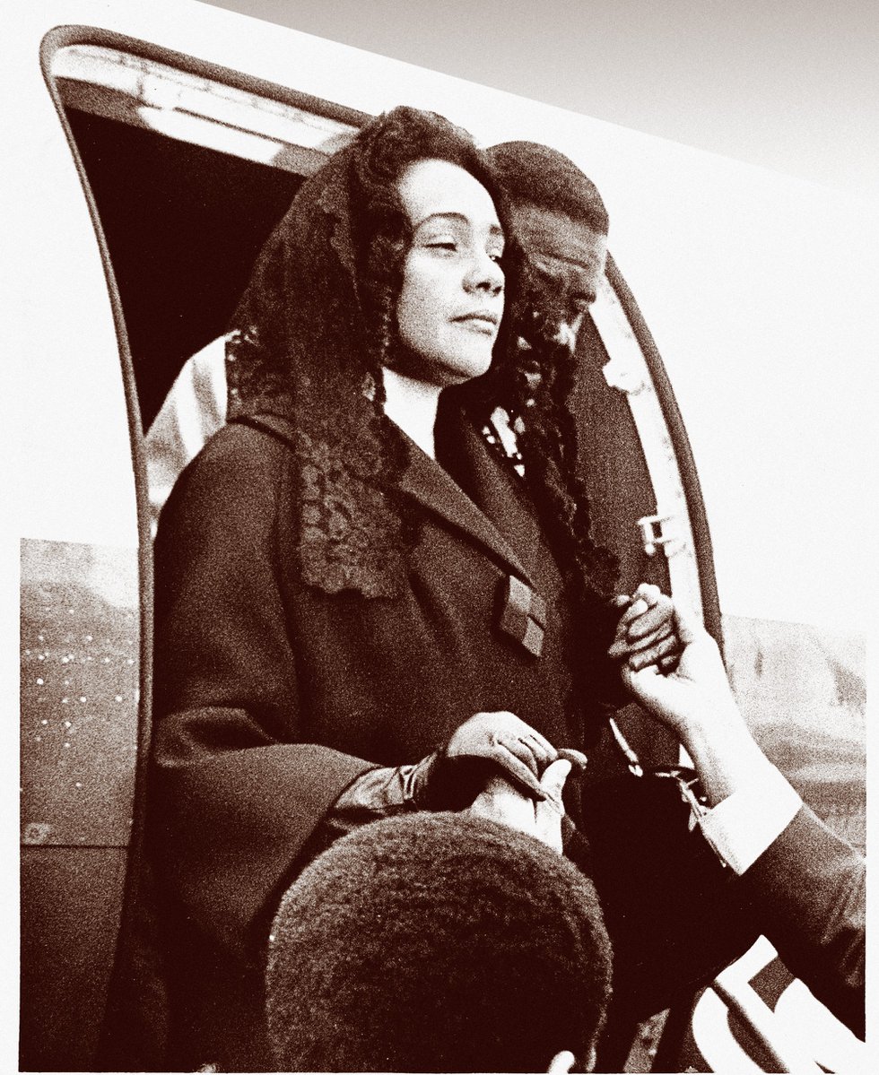 Stunned but poised, a grieving Coretta Scott King arrives at the Memphis airport to escort her husband’s body home.