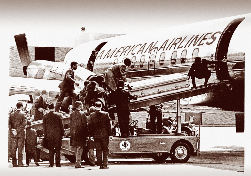 King’s bronze coffin is moved aboard an American Airlines jet at the Memphis airport, to be transported home to Atlanta.