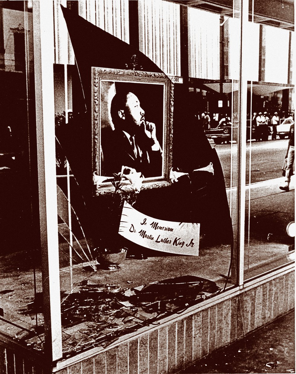 A storefront window on North Main Street, shattered by the riots and demonstrations that followed King’s death, was transformed into a makeshift memorial to the civil rights leader.