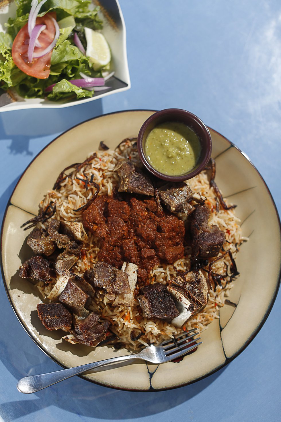 Derae Restaurant: Crispy hanid, or goat meat on rice, is for adventuresome eaters. 