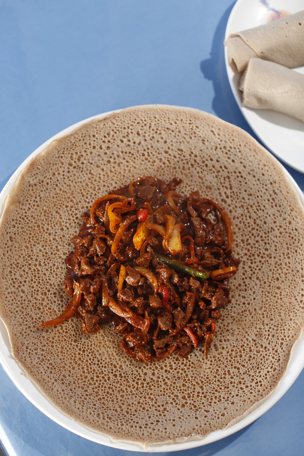 Derae Restaurant: Ethiopian fermented flatbread, called injera, cradles tibs, a spicy stew. 