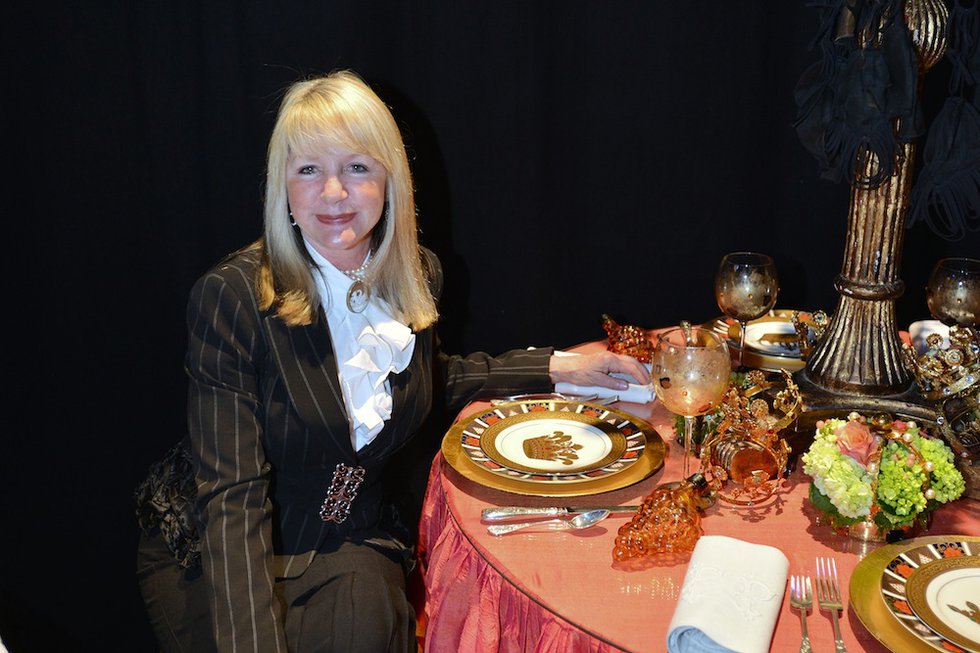 Lucy Woodson at a table designed with Shirley Turner