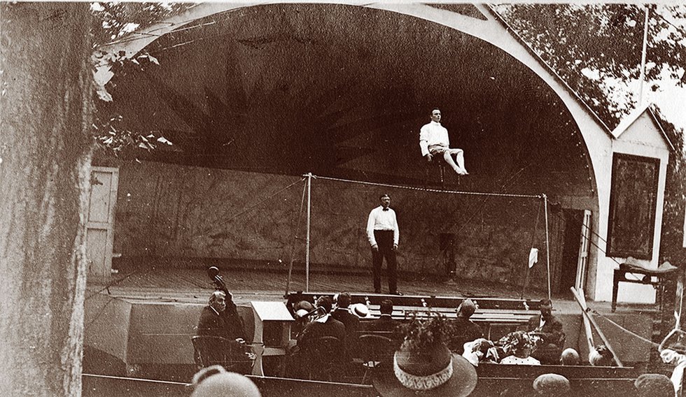 The Frill Act, 1910, featured high-wire performers, such as this gentleman seated in a chair while balancing on a tightrope. 