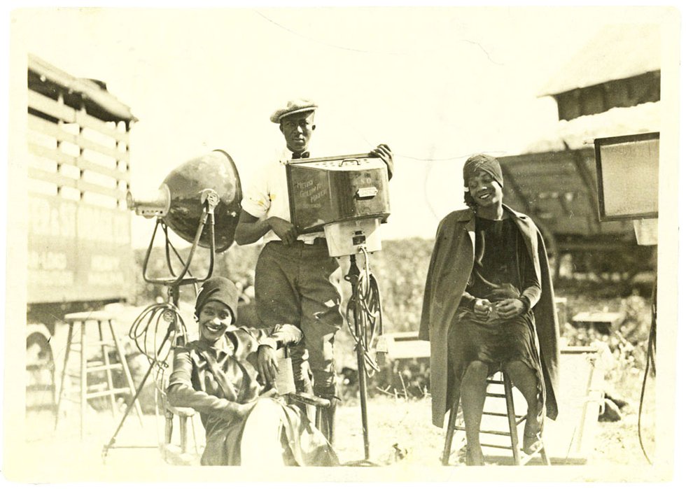On location at Wilson Plantation in Arkansas, two unidentified performers relax with a member of the production crew. Historians are still trying to identify many of the men and women featured in the film.