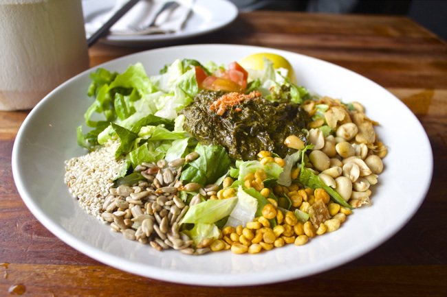 Tea Leaf Salad at Burma Superstar located in the Inner Richmond neighborhood of San Francisco is a show-stopping combination of peanuts, lentils, romaine, fried garlic, and fermented tea leaves.