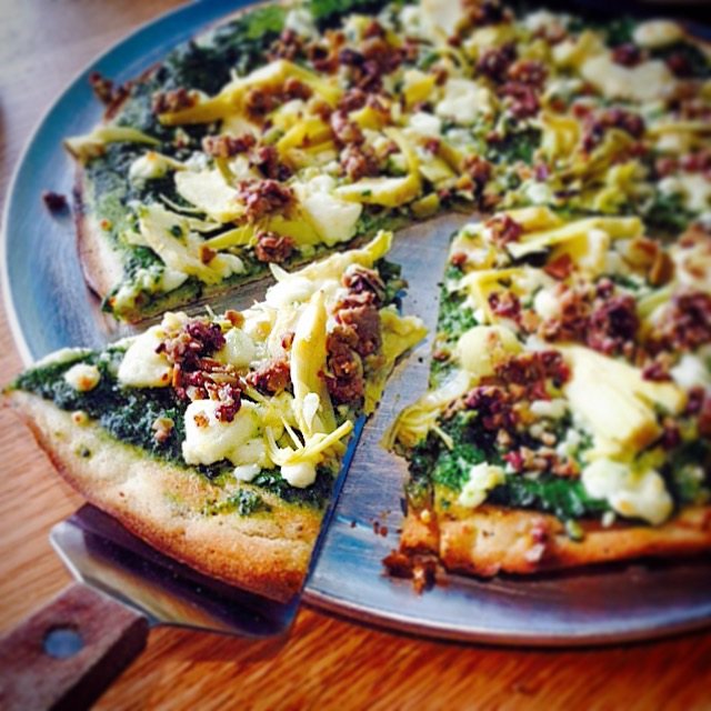 Signature pizzas highlight the menu at Maui Brick Oven, including the Paradise Pesto made with artichoke hearts, roasted garlic, and chopped green olives.