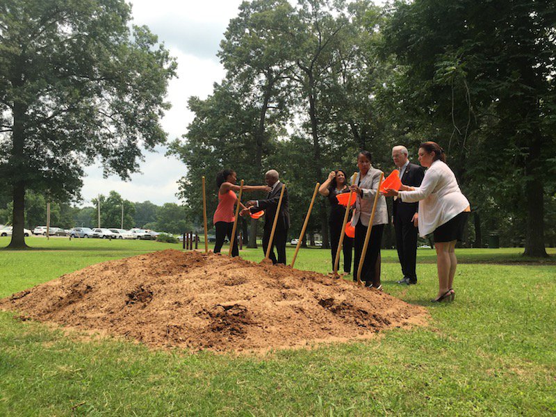 A crowd of local leaders breaks ground on a new adult fitness station in Audubon Park.