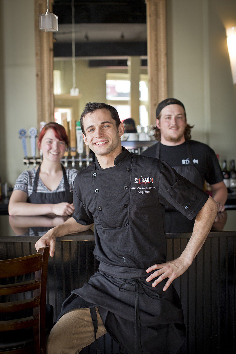 Chef/owner Josh Steiner, baker Emily Methvin, and sous chef Cole Owen are the kitchen team at Strano Sicilian Kitchen, serving family recipes along with updated pastas, pizzas, and seafood.